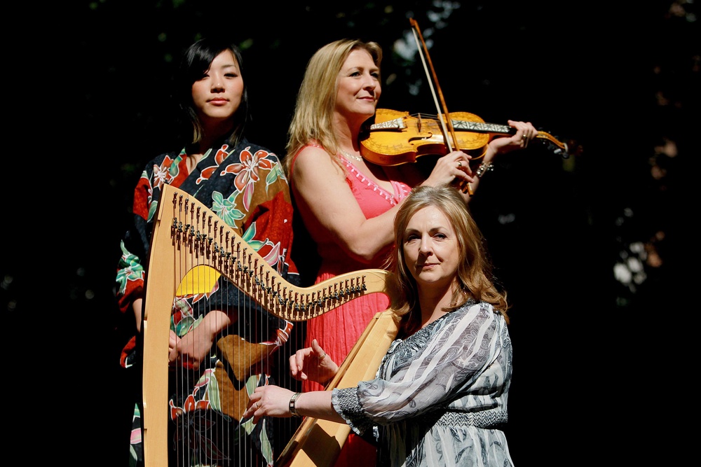 Moya Brennan on harp with Chika Usami and Mairead Ni Mhaonaigh (Julien Behal/PA) (PA)