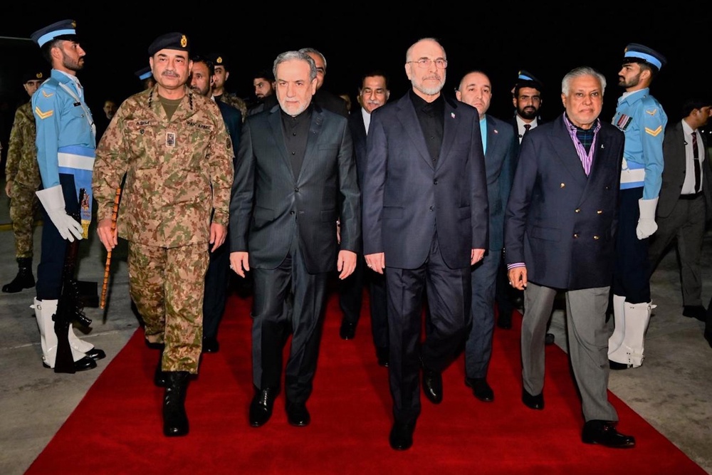Iran's Parliament speaker Mohammad Bagher Qalibaf and Iran's foreign minister Abbas Araghchi are greeted by Pakistan foreign minister Ishaq Dar and Army Chief Field Marshal Gen. Asim Munir upon their arrival at Nur Khan airbase in Rawalpindi (AP)
