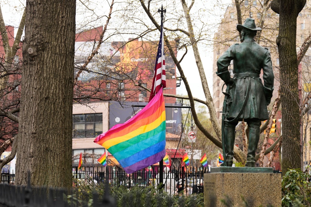 A rainbow Pride flag flies with an American flag at the Stonewall National Monument in New York, Monday, April 13, 2026 (AP)