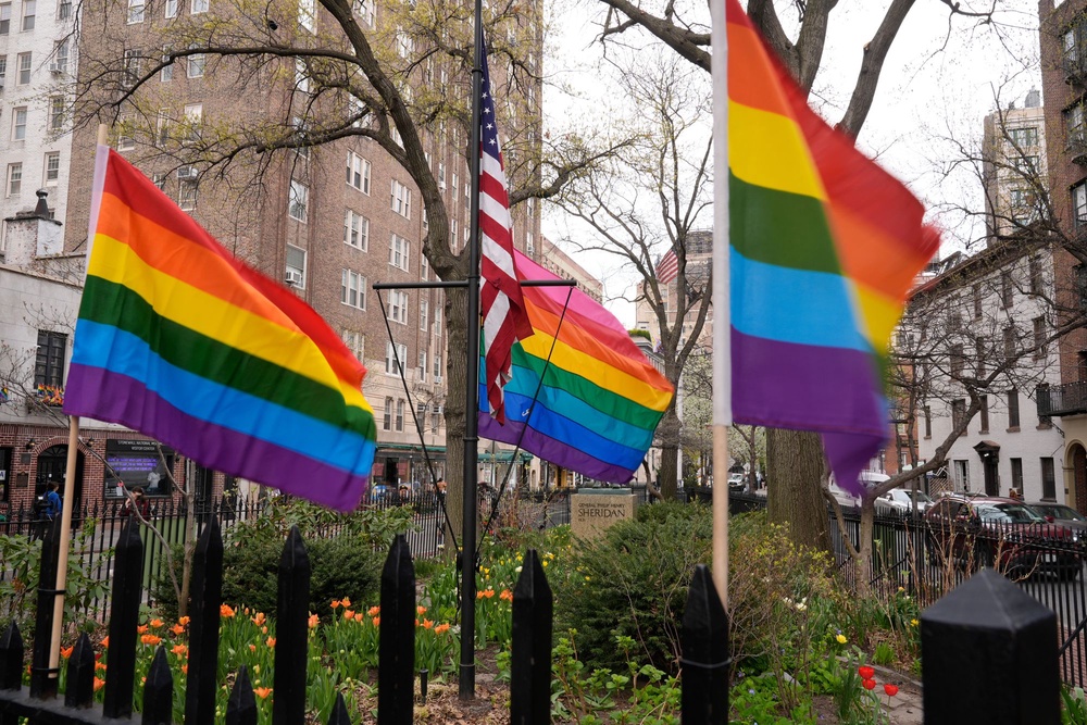 Small rainbow Pride flags are displayed near a flagpole with a larger Pride flag at the Stonewall National Monument in New York, Monday, April 13, 2026. (AP Photo/Seth Wenig) (AP)