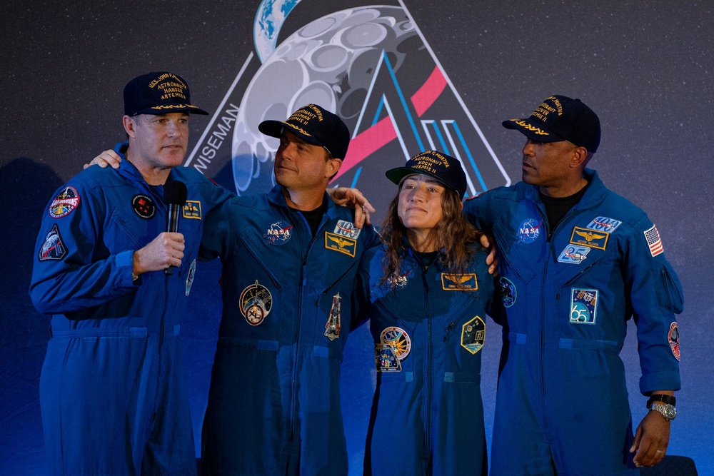 Artemis II astronaut Jeremy Hansen, left, speaks at a news conference with fellow crew members (left to right) Reid Wiseman, Christina Koch and Victor Glover on Saturday at Ellington Field Joint Reserve Base in Houston, Texas. The astronauts will field questions about their mission again on Thursday (Getty Images)
