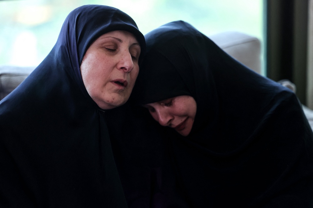 Ahlam Badawi (left), the mother of killed paramedic Hassan Badawi, receives condolences at her home in the town of Bchamoun, south of Beirut, on Monday (AFP/Getty)