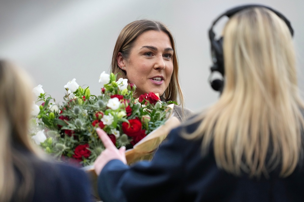 She was presented with a bouquet of flowers and special framed shirt (AP)