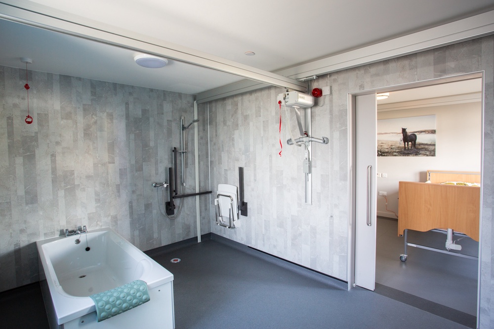 Track hoists allow access into a large wet room at the Jordan Suite (Haven Centre)