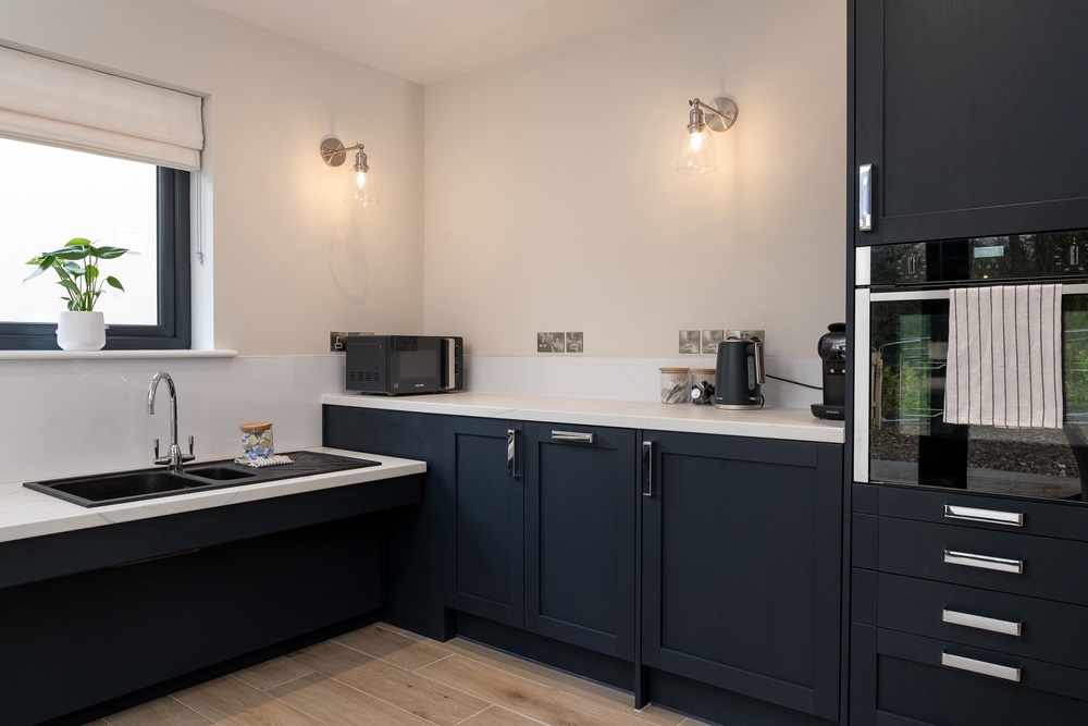 Rose Cottage has a practical kitchen with French doors that open onto the rear garden (Harry Atkinson)