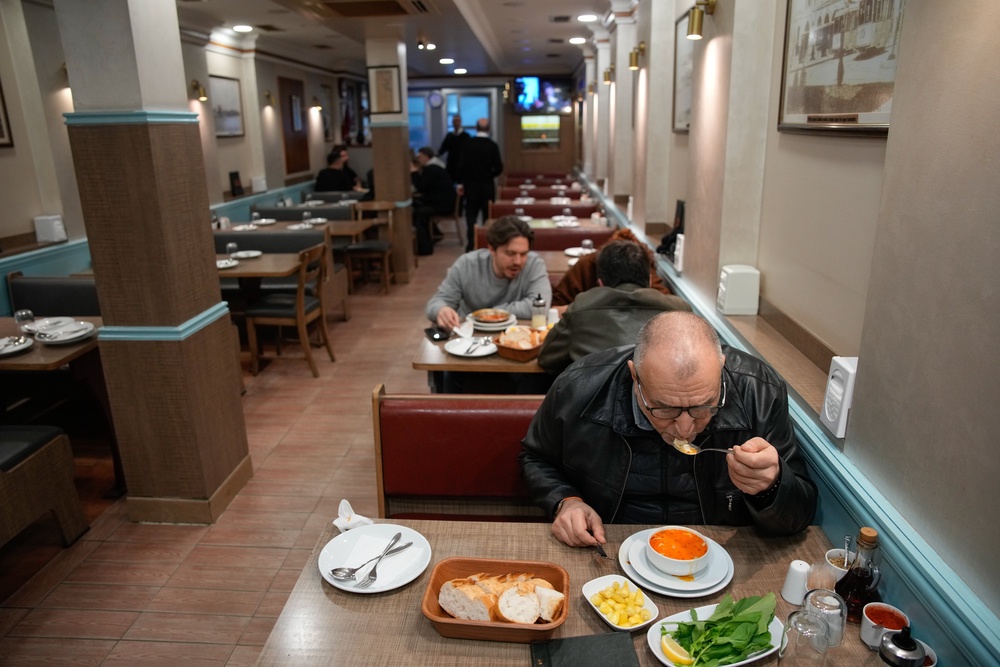 Customers tuck in at a restaurant in Turkey (AP)