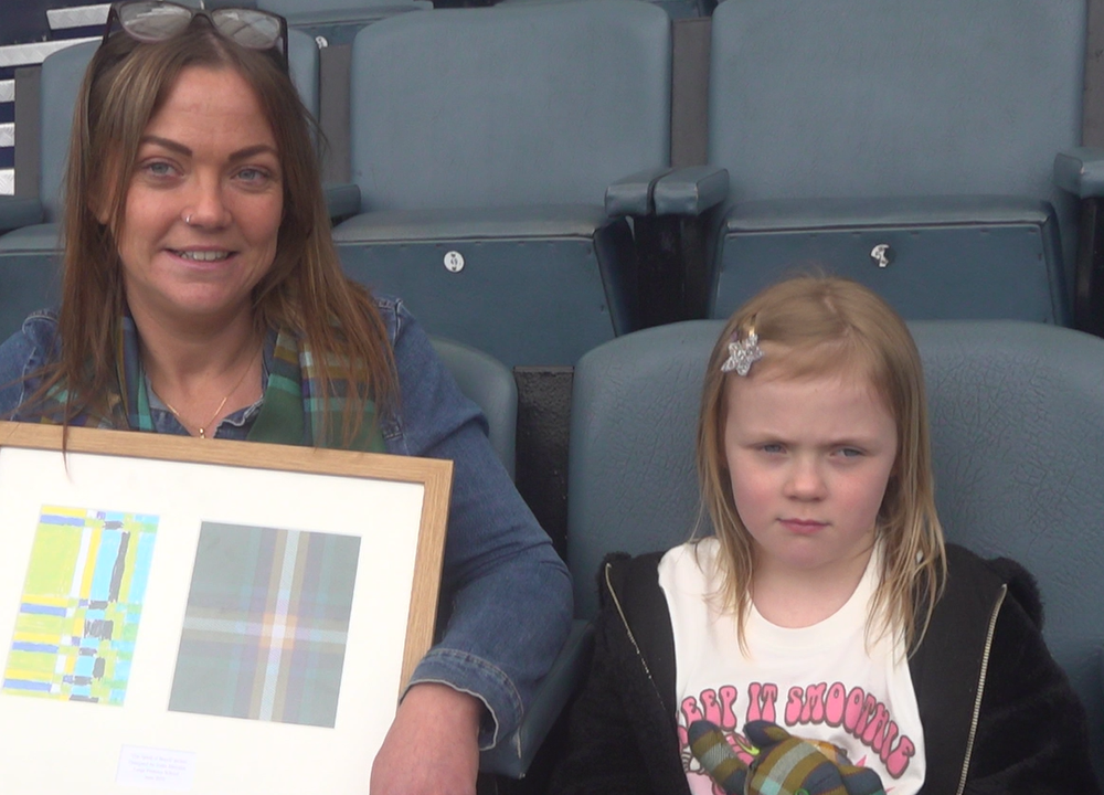 Scotland’s youngest tartan designer Indie, aged six, and mum, Jodie Menzies. (Ryan McDougall/PA)