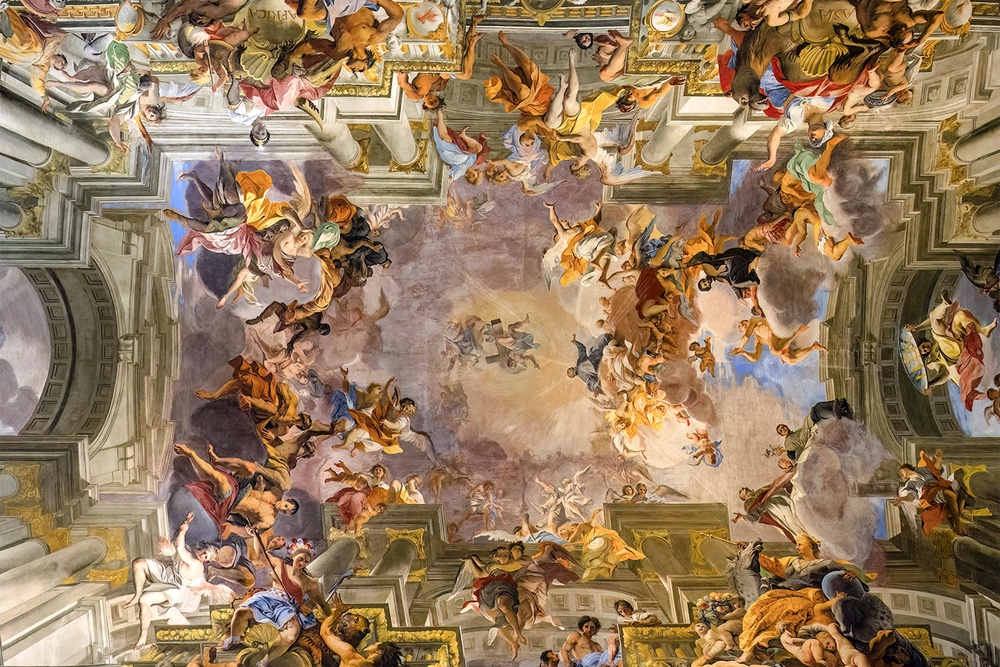 ‘Saint Ignatius Being Received into Heaven’ by Andrea Pozzo shares the same golden colour hues as Trump’s image and is also packed with activity (Church Sant'Ignazio)