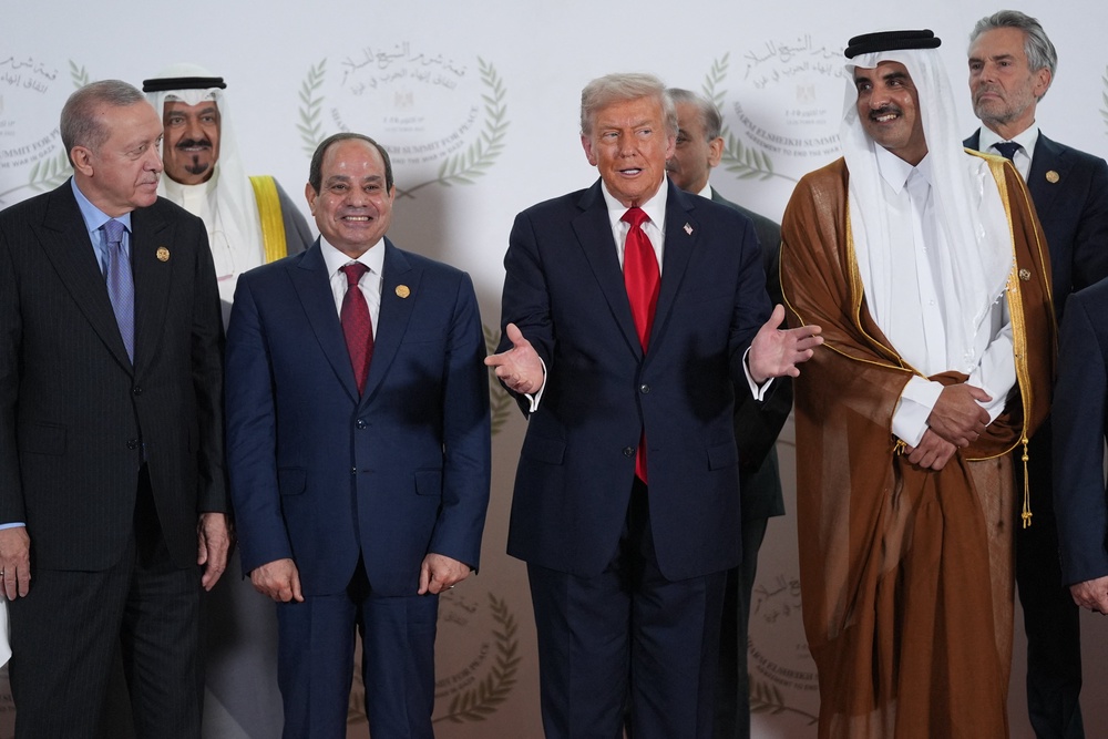 Turkish President Recep Tayyip Erdogan, Egyptian President Abdel Fattah al-Sisi, US President Donald Trump, and Emir of Qatar Cheikh Tamim ben Hamad al-Thani and other leaders pose for a family picture at the Gaza summit in Sharm El-Sheikh on 13 October 2025 (AFP/Getty)