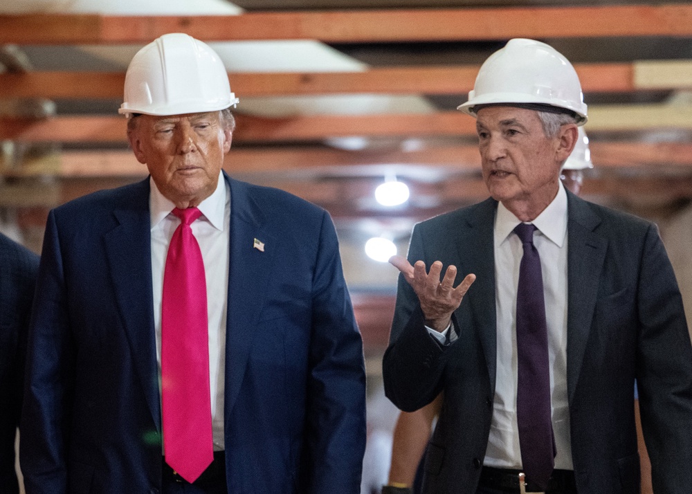 President Donald Trump speaks with Federal Reserve chair Jerome Powell on a visited to the Fed's under-renovation headquarters last July (AFP/Getty)