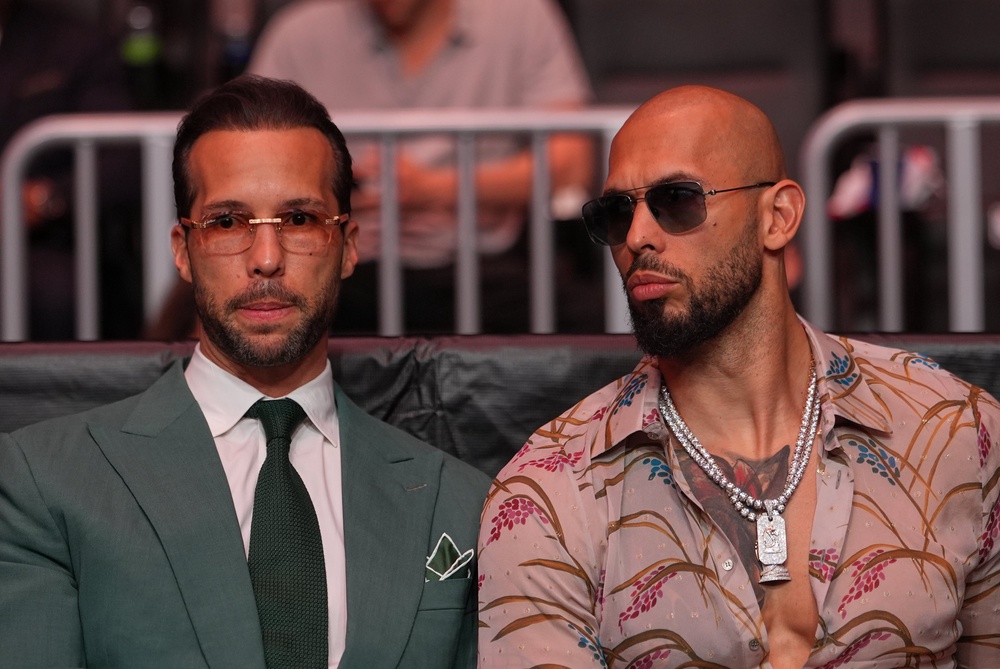 Tristan Tate (left) and Andrew Tate (right), pictured here at UFC 327,  are facing multiple investigations, including allegations of rape and human trafficking, in multiple countries (Getty)