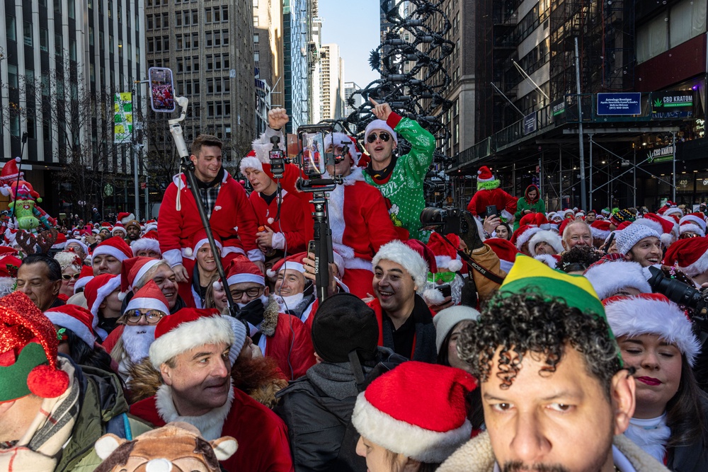 SantaCon is a sprawling bar crawl that draws thousands of people dressed up like Santas and other winter holiday characters (Getty Images)