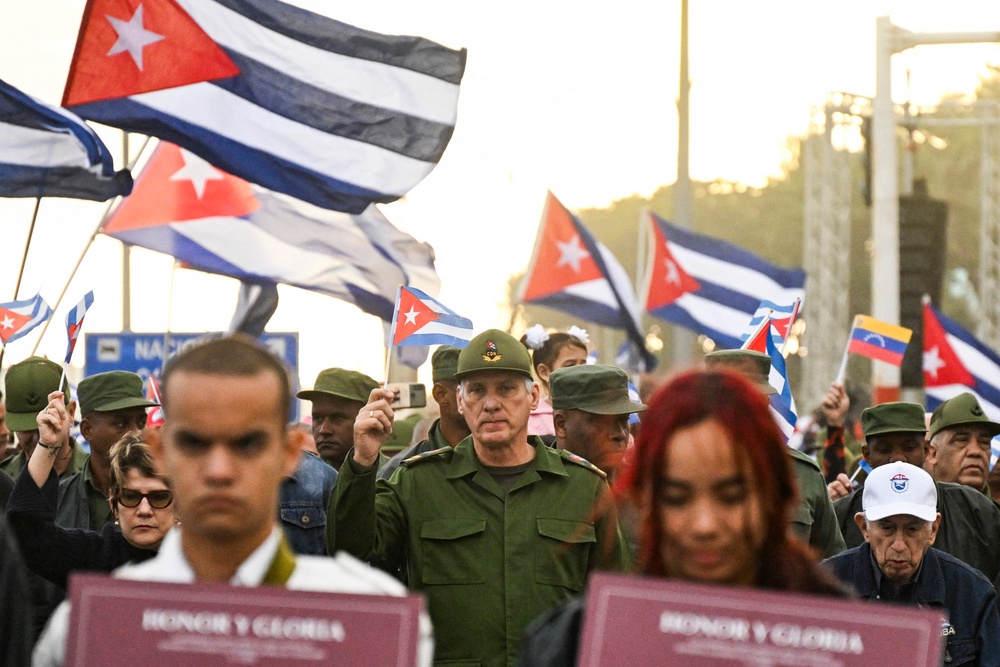 Cuba's President Miguel Diaz-Canel (center) has repeatedly denounced the Trump administration’s hostile rhetoric. In January, he said that his government was 'ready to defend the homeland to the last drop of blood' (POOL/AFP via Getty Images)