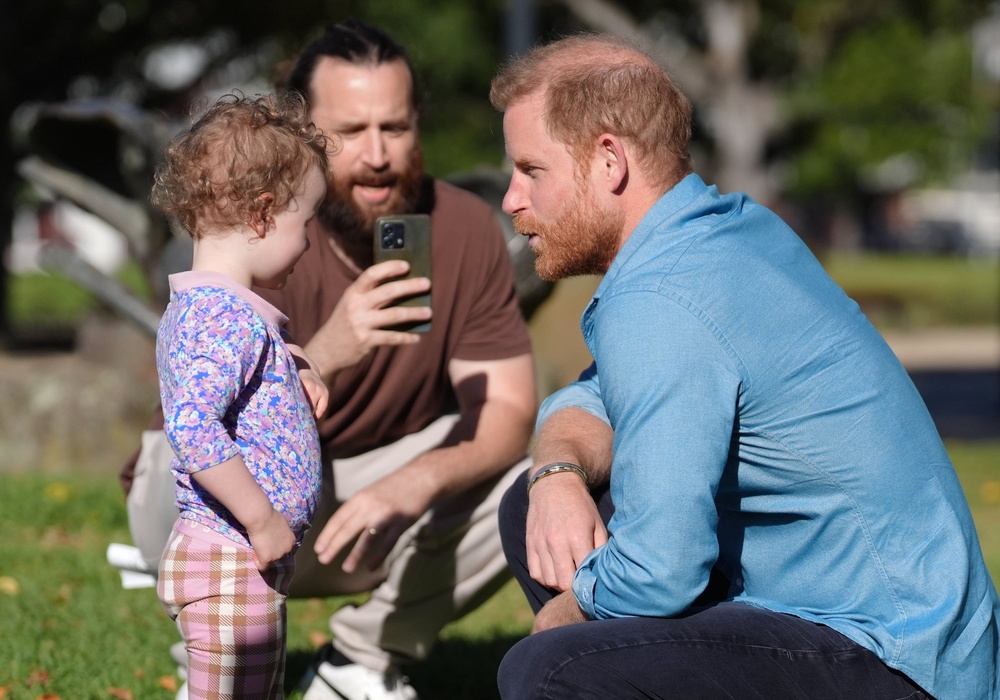 The Duke of Sussex meets Heidi, three, and her father Rohan Davies at the Scar Tree Walk in Melbourne, Victoria (Jonathan Brady/PA) (PA Wire)