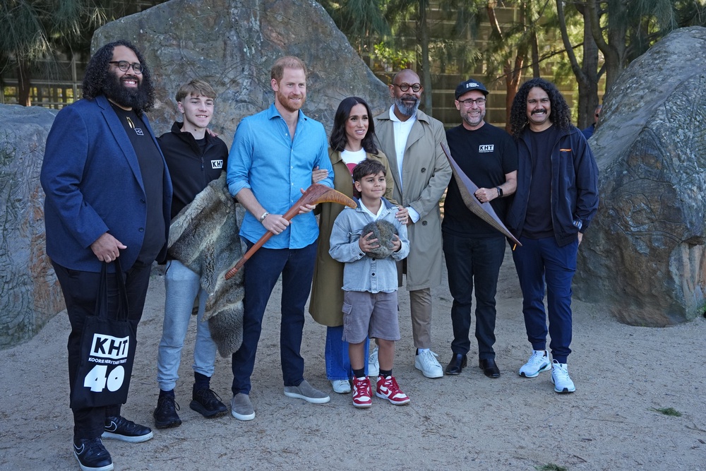 The Duke and Duchess of Sussex pose for a photo with representatives of the Koorie Heritage Trust at the Scar Tree Walk in Melbourne (Jonathan Brady/PA) (PA Wire)
