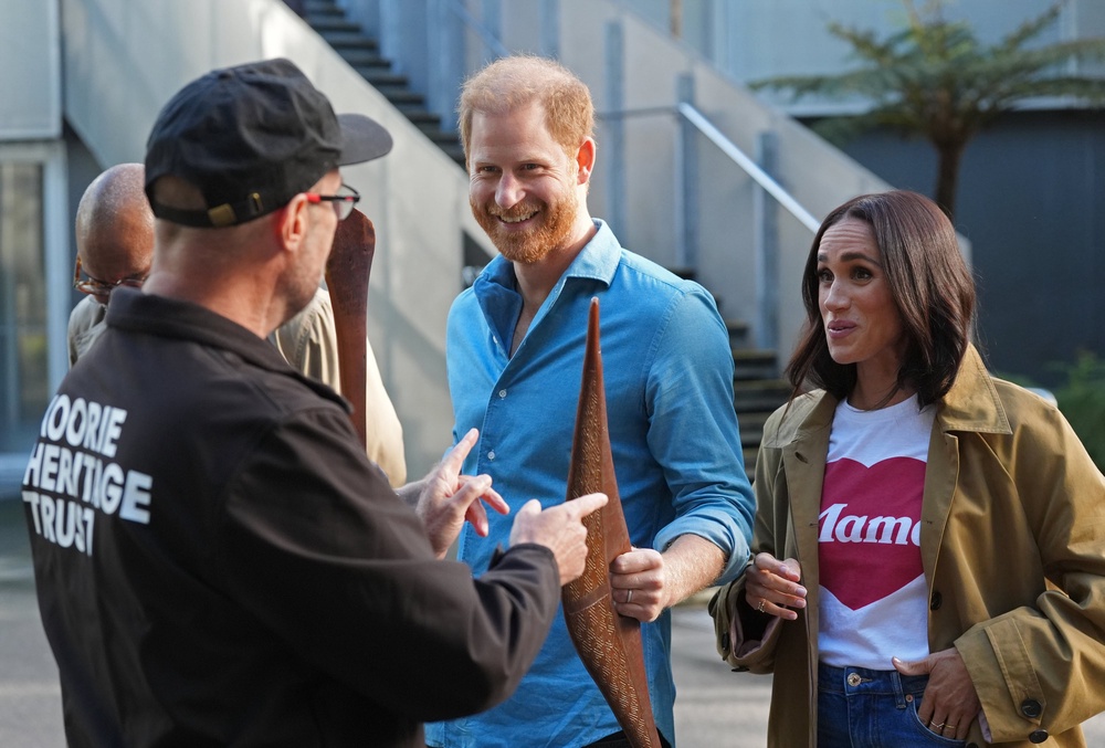 The Duke and Duchess of Sussex are shown Indigenous items by representatives from the Koorie Heritage Trust at the Scar Tree Walk in Melbourne (Jonathan Brady/PA) (PA Wire)