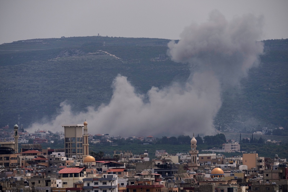 Smoke rises following an Israeli airstrike on the village of Qlaileh, as seen from the southern port city of Tyre (Copyright 2026 The Associated Press. All right reserved)