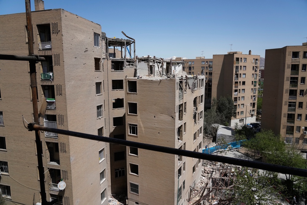 A residential building is seen damaged after being hit by a strike in south-eastern Tehran, Iran (Vahid Salemi/AP) (AP)