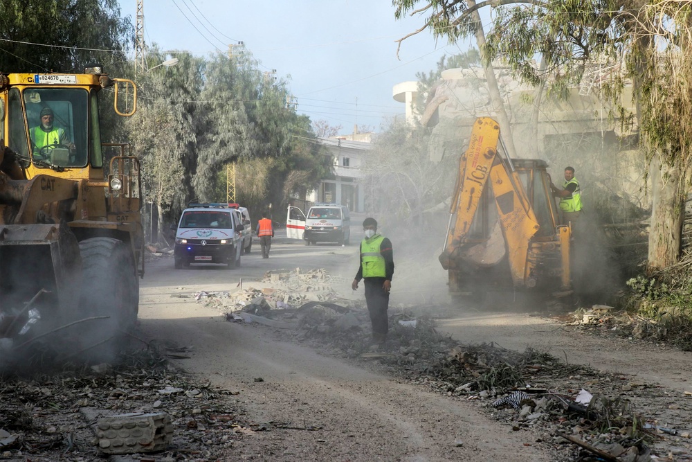 First responders gather at the site of an Israeli airstrike that targeted the southern Lebanese village of Srifa on April 14 (AFP/Getty)