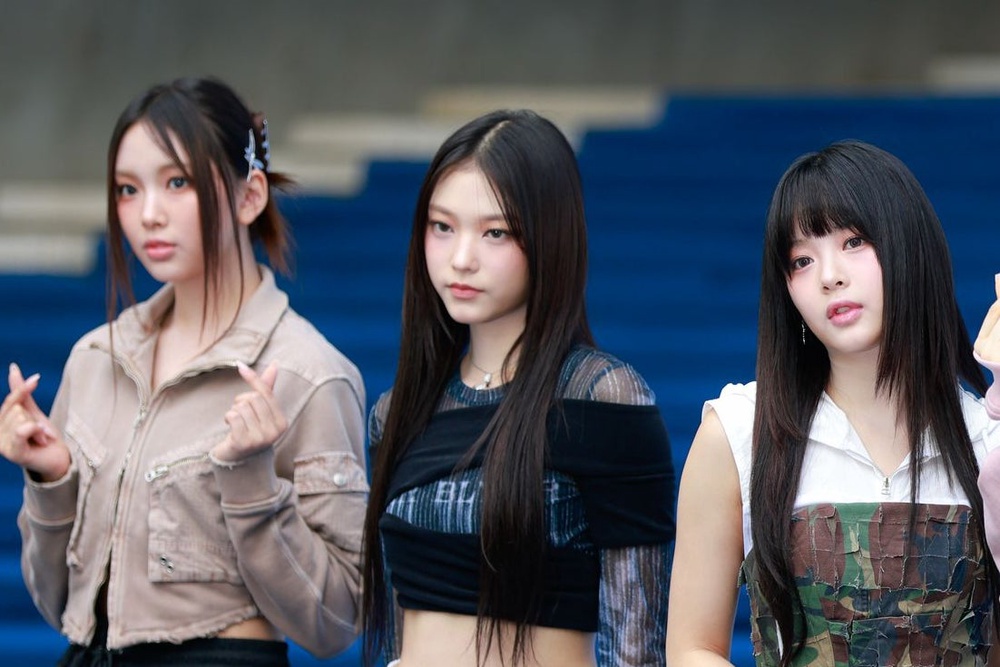 Eyewitness accounts and images circulating on social media over the weekend appeared to show members Hyein (left), Haerin (centre), and Hanni in the Danish capital (Getty Images)