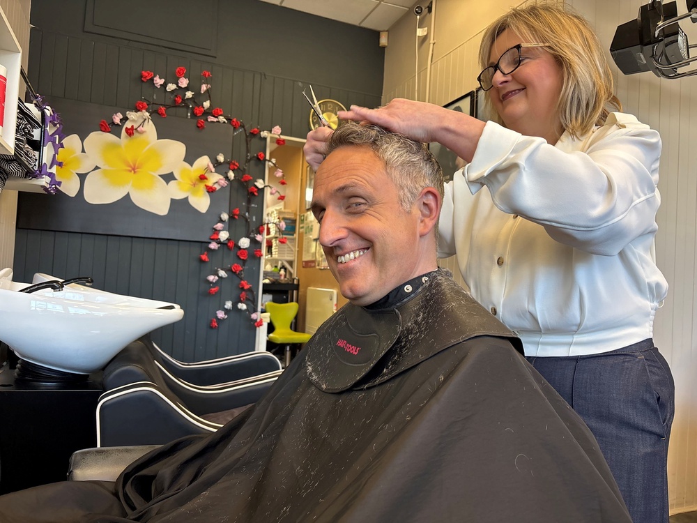 Alex Cole-Hamilton also championed Lib Dem plans to help small businesses while having his hair cut at a salon on Thursday (Nick Forbes/PA) (PA Wire)