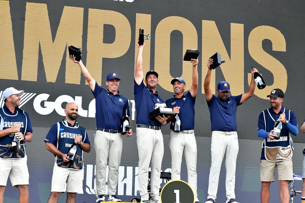 Bryson DeChembeau, centre, and his team celebrate their win at Midrand, South Africa (Getty)