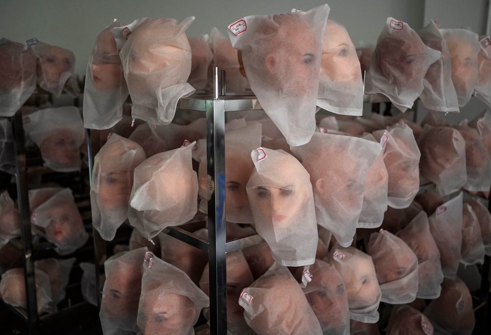 Heads for silicone sex dolls are seen on racks in the production area at a factory for WM Dolls (Getty)