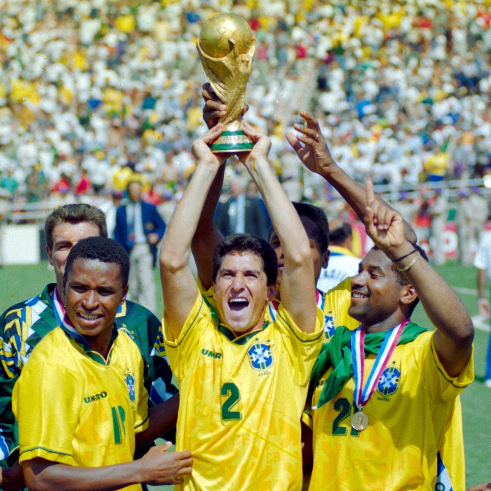 Paulo Sergio #18, Jorginho #2 and Viola #21 from Brazil celebrate with the FIFA World Cup Trophy after winning the 1994 FIFA World Cup Final between Italy and Brazil (Shaun Botterill/Allsport/Getty Images) (Getty)