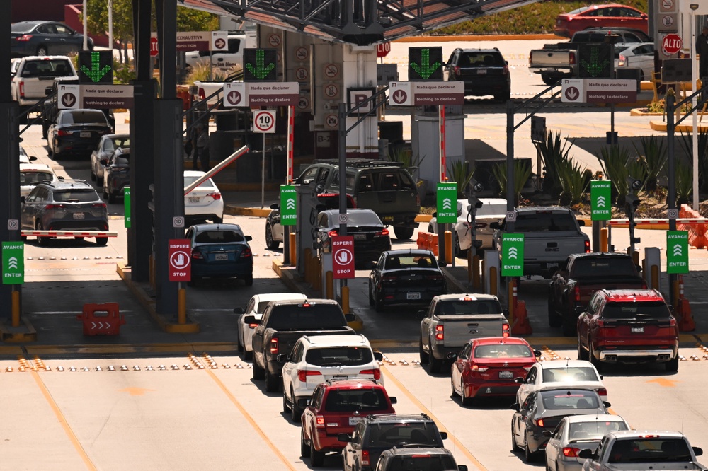 Vehicles crossing the US-Mexico border through the crossing at San Ysidro. Cities such as Tijuana, Los Algodones and Cancun have all become hubs for medical tourism as Americans look to save money on bills for themselves, and their pets (AFP/Getty)