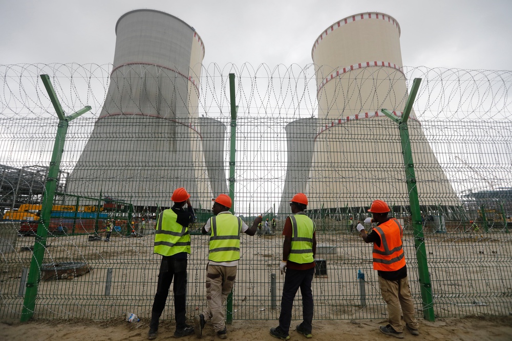 Workers fix barbed wire on the fence of the Rooppur Nuclear Power Plant at Ishwardi in Pabna, Bangladesh (Associated Press)