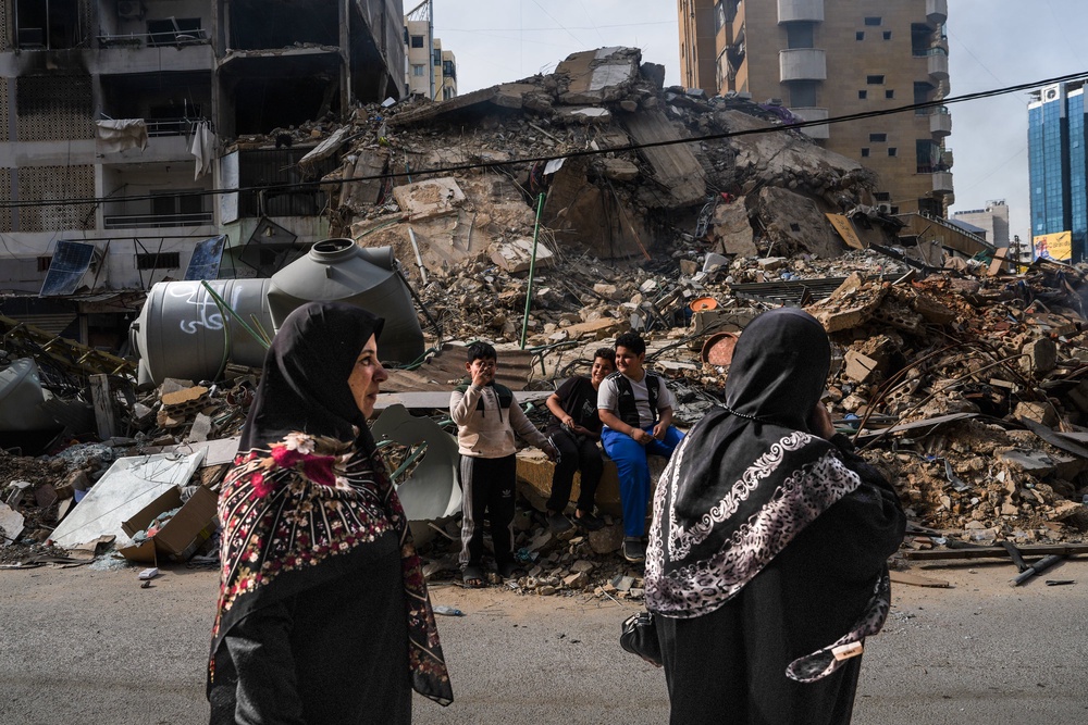 People congregate near the site of an Israeli strike in the Dahieh neighborhood on the first day of the newly announced cease-fire between Israel and Lebanon, on April 17 (Getty)