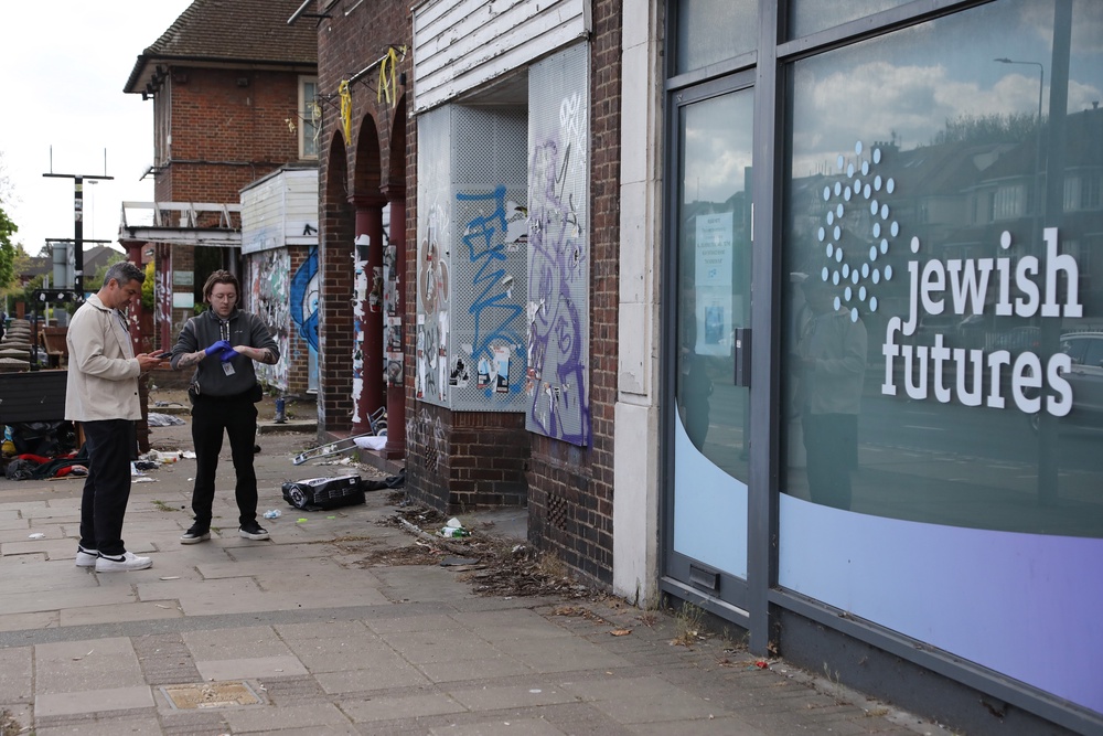 Police investigate the scene of an attempted arson attack on 18 April 2026 in Hendon, north London (Getty Images)