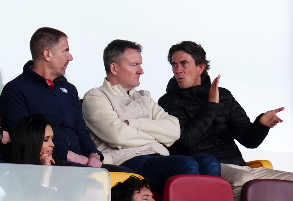Thomas Frank (right) watched his former team from the stands (PA)