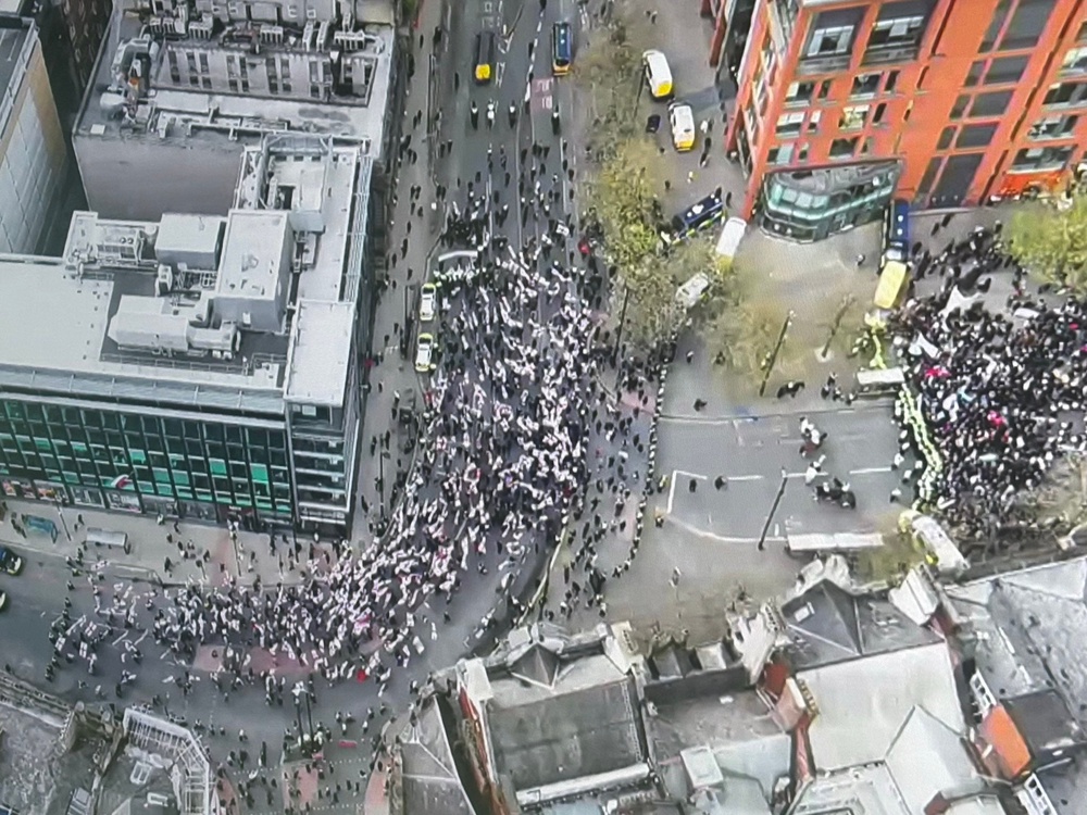 Britain First protesters march past counter-demonstrators (Greater Manchester Police)