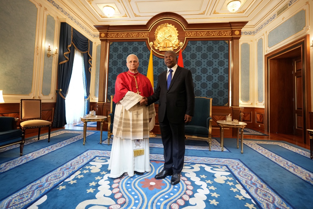 Pope Leo XIV shakes hands with Angola's President Joao Lourenco, during their meeting at the Presidential Palace in Luanda, Angola on Saturday (Reuters)