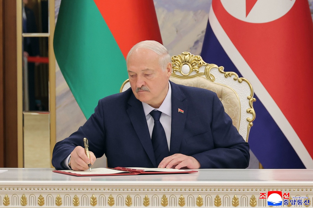 Belarus president Alexander Lukashenko signs a document in Pyongyang, North Korea Thursday, 26 March 2026 (AP)