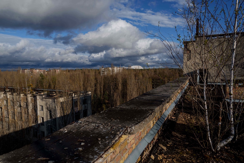 Abandoned houses are seen overgrown with vegetation at the Chernobyl exclusion zone in Prypiat, Ukraine, Monday, April 6, 2026. Chornobyl is the Ukrainian name for the city. (AP Photo/Evgeniy Maloletka) (Copyright 2026 The Associated Press. All rights reserved)