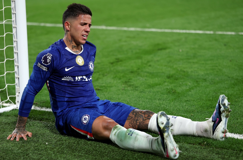 Enzo Fernandez of Chelsea reacts after a calf problem (Getty)