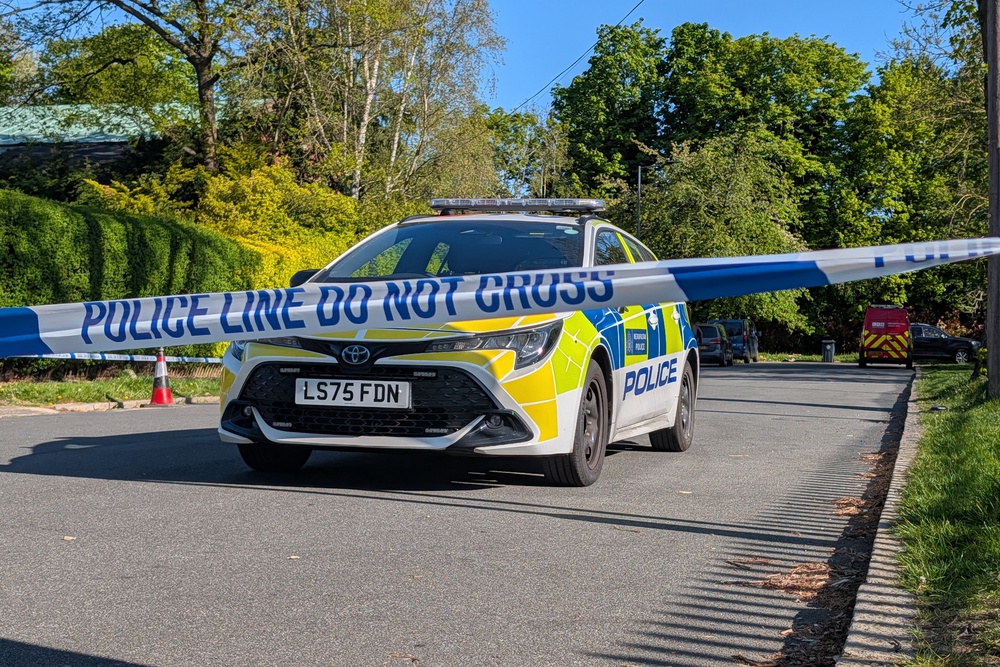 Police officers patrol at a cordon near an incident at the Kenton United Synagogue in Harrow, northwest London (Jamie Lashmar/PA)