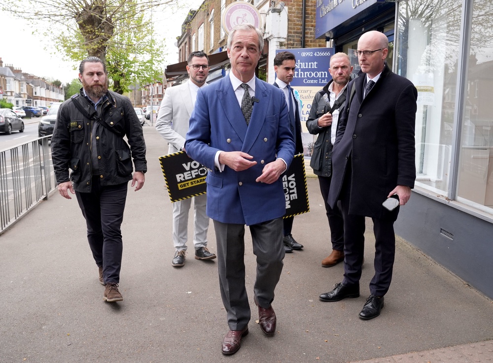 Nigel Farage on the campaign trail with local elections coming up next month (PA)