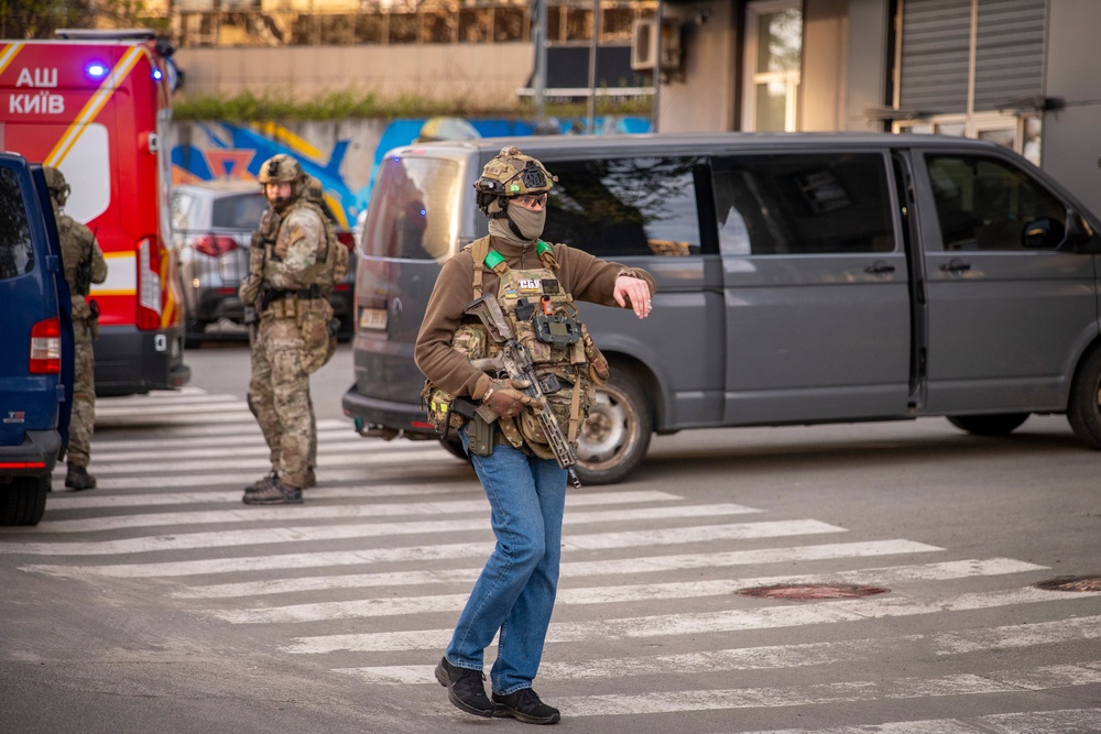 Police officers are seen in the site where a gunman killed at least six people in the streets before being shot dead by police, in Kyiv, Ukraine, Saturday, April 18, 2026 (AP)