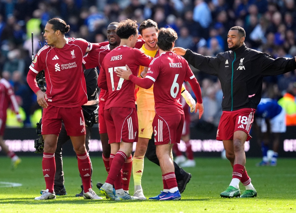 Liverpool players congratulate goalkeeper Freddie Woodman following the 2-1 win (PA)