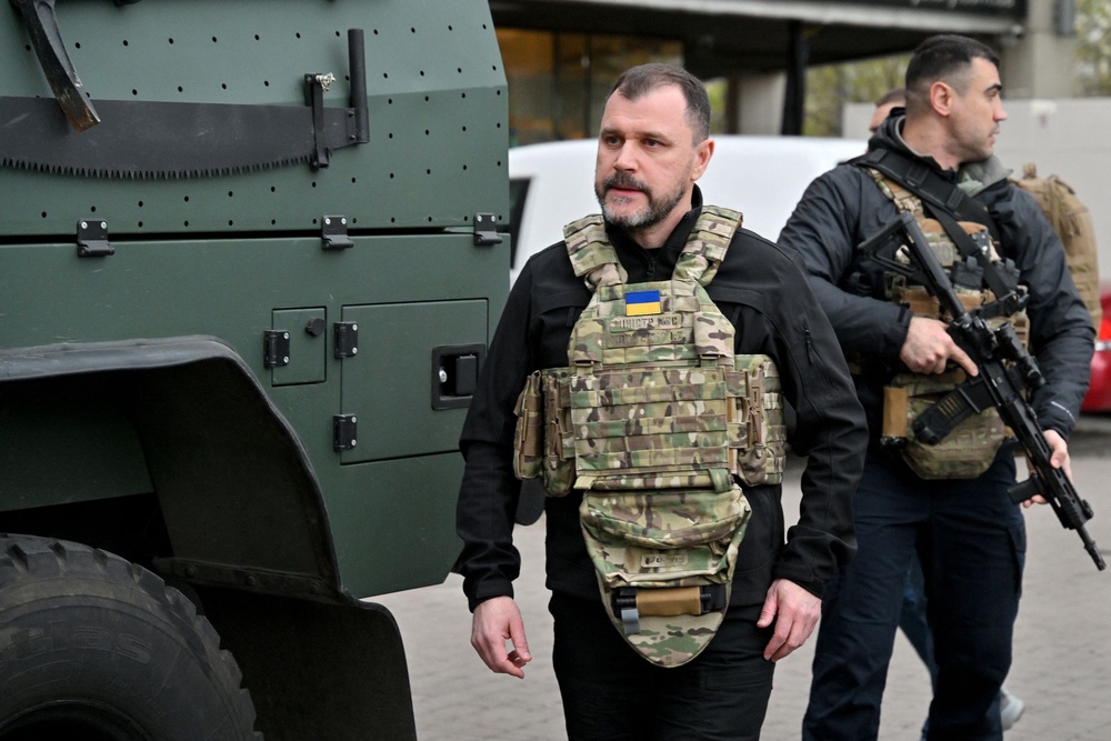 Ukraine's Minister of Internal Affairs Igor Klimenko walks outside a supermarket following a shooting in Kyiv on 18 April 2026 (AFP via Getty Images)