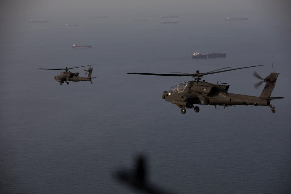 Two U.S. AH-64s fly on patrol above the Strait of Hormuz near Iran on April 18, 2026. Apaches have been widely used in the current Iran war by both the U.S. and Israel, including using their 30mm cannon to shoot down Iranian kamikaze drones (US Centcom)