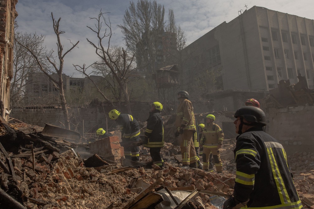 Ukrainian rescuers work at the site of heavily damaged buildings following a Russian air attack in Dnipro, on 16 April 2026, amid the Russian invasion of Ukraine (AFP via Getty Images)