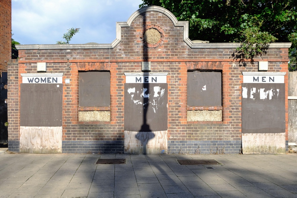 2FYDYGJ London, UK. Disused and boarded up Victorian toilet block in High Road, Tottenham.