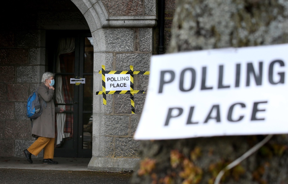 Voters arrive at the War Memorial building in Aboyne, Aberdeenshire which is being used as polling station (Andrew Millian/PA) (PA Archive)