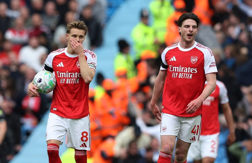 Arsenal's Martin Odegaard and Declan Rice react after going behind against Man City (Reuters)