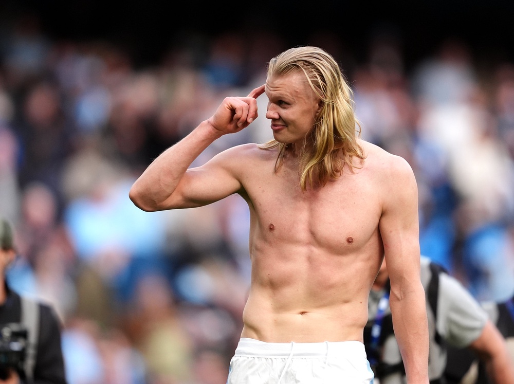 Erling Haaland pulled his shirt off before soaking up the adulation at the Etihad (PA)