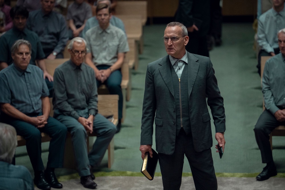 Christopher Ecclestone as cult leader Mr Phillips in 'Unchosen' (Netflix)